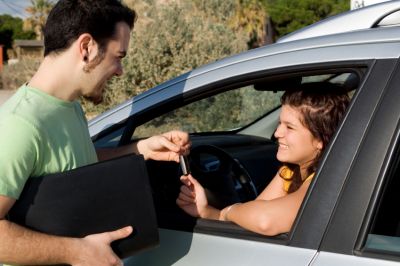 A woman renting a car